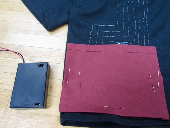 Sew it down using regular thread.