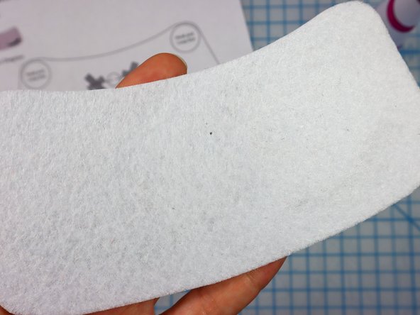 Use a push pin to make two holes for the LED's legs. When the push pin is inside the felt, rotate it around a bit to make the hole larger and easier to see.