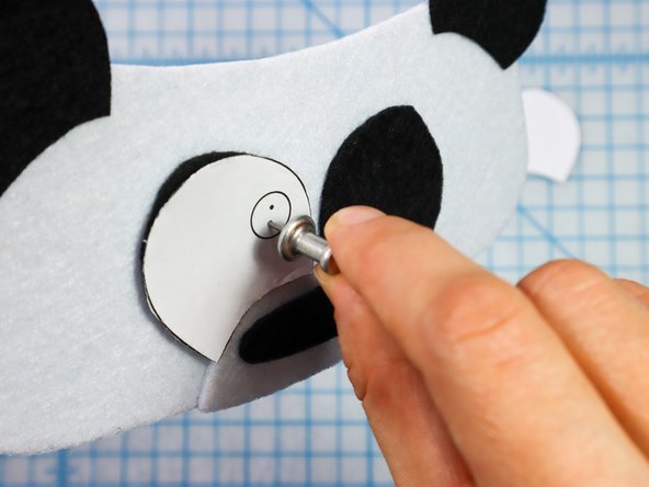 Use a push pin to make two holes for the LED's legs. When the push pin is inside the felt, rotate it around a bit to make the hole larger and easier to see.