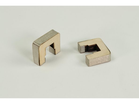 Cut a piece of Maker Tape long enough to wrap around the outside, and part of the inside, of the small &quot;U&quot; shaped pieces.