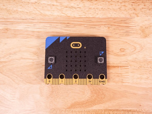 Insert the legs of the buttons through the slots for the A and B buttons on the 3D Printed Micro:Bit.