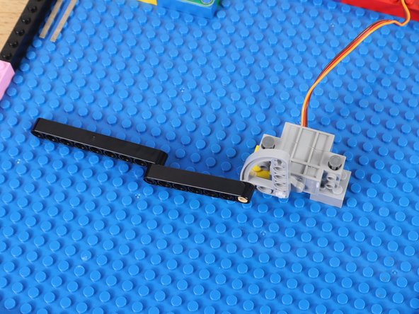 You could also use two LEGO Brick 2 x 2 Round (3941 / 6143) or any other method of mounting the servo on its side.