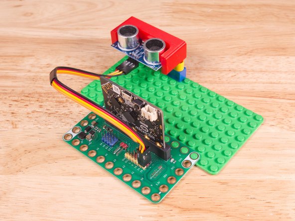 Plug the three-wire connector of the Crazy Circuits Ribbon Cable into the row with Pin 13 on the Bit Board. The wire colors should match the pin header colors, with S1 (yellow) going to the yellow pin.