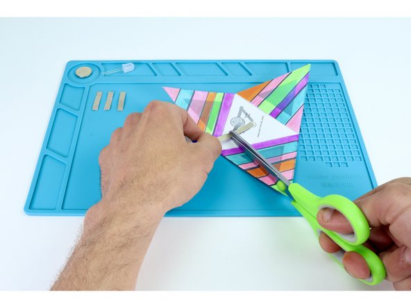 Measure and cut the 5 pieces of Maker Tape indicated on the circuit diagram. Remember: although there are only 4 paths, you will need one tape length to make a tape loop for the battery where indicated on the diagram.
