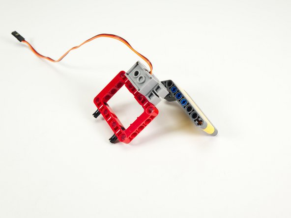 Note that we may need to adjust how the arm is attached when we load the code, as it will depend on the angle of the servo, but for now we just want to attach it.