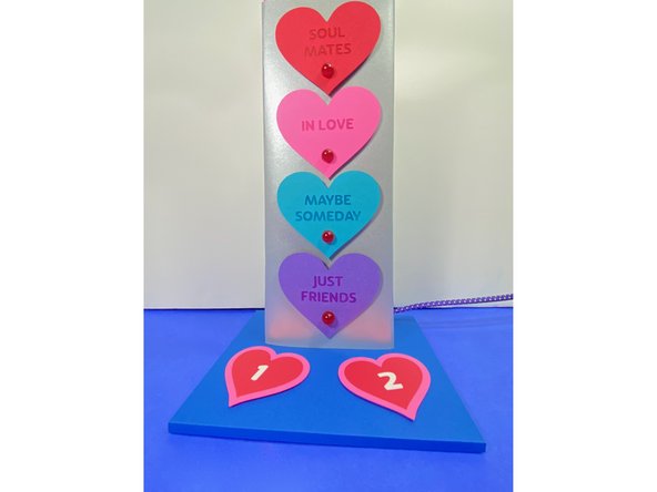 We used adhesive foam dots, and doubled them up (put one on top of the other) to create extra dimension.