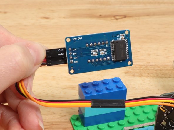 Add the 7 Segment Display by connecting jumper wires to the correct pins on the module and the Bit Board.