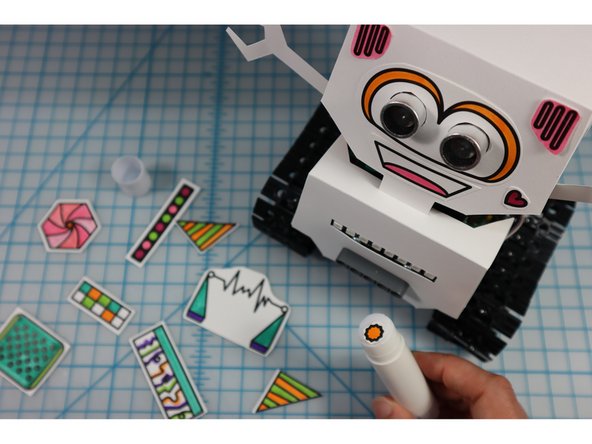 Color in the robot embellishments and glue them to the bot. What type of personality will your bot have?