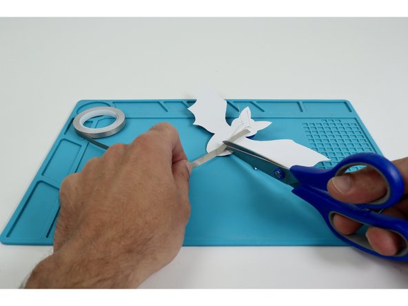 Measure and cut three pieces of Maker Tape that are approximately the length of the Long LED Legs.