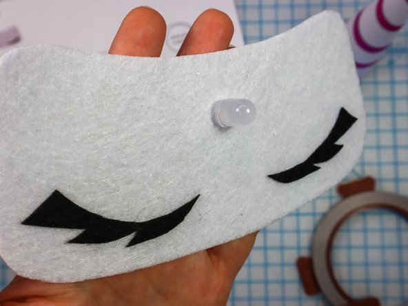 Insert the LED through the holes.