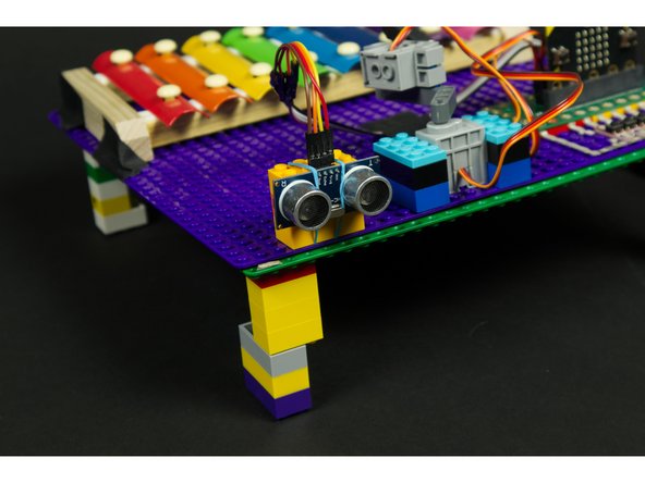 We found that a few rubber bands and LEGO bricks work well to hold our sensor in place pointing in the right direction. (Tape can also work.)
