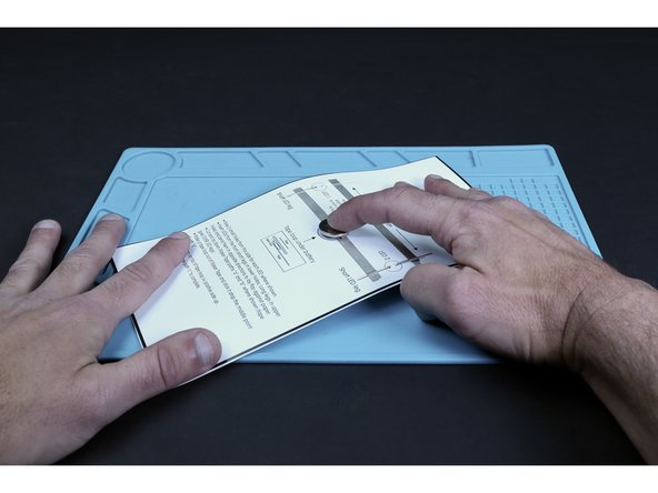 Stick the battery atop the tape loop with the positive (+) side facing UP.