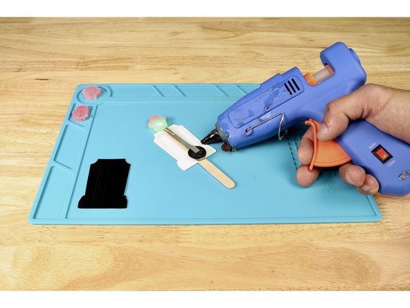 Flip the graphic version of the tombstone face down and lay your working circuit stick on top/centered as shown. The ghost should be above the top of the tombstone while the rest is below that line on top of paper.