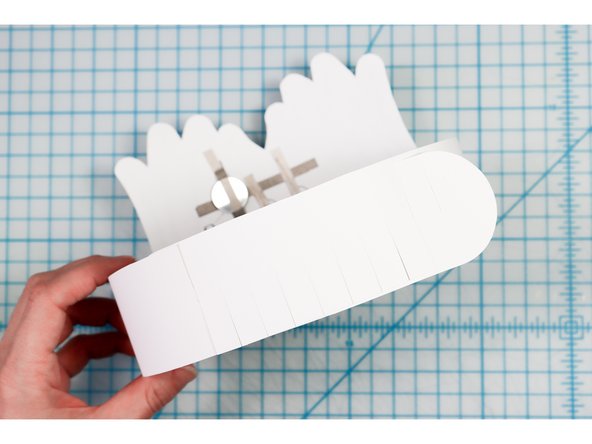 Interlock the slits in two places to create the size that works for your head.