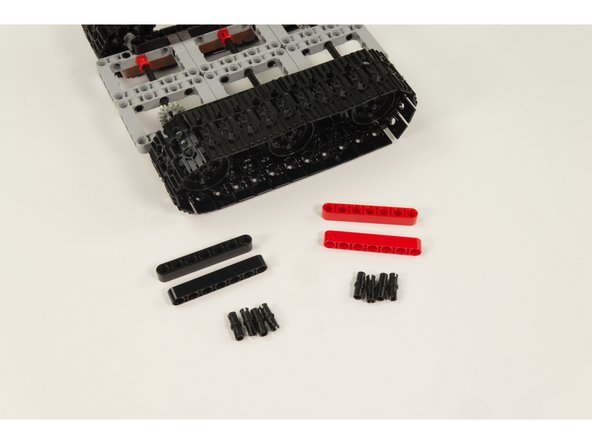 We'll use the 4 LEGO Beam 7 parts to raise and mount the servos to the proper position.