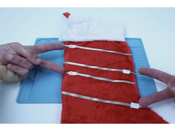 Now  measure, cut peel and stick this new  path as shown using the rulers to make sure this path runs parallel to the one above it along its' entire length.