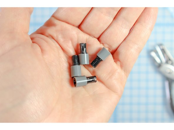 Connect each LEGO pin to a LEGO round beam as shown.