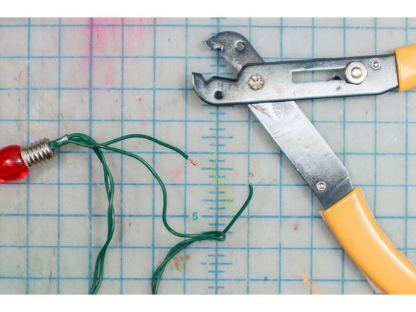 Cut one of the wires coming out of the battery pack and strip the ends.