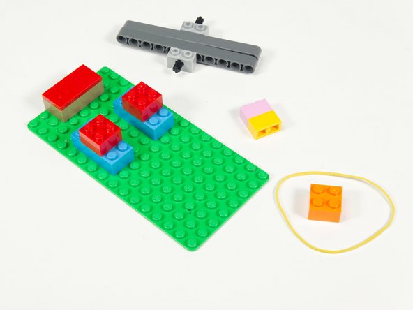 Next we'll use our Rubber Band and a 2 x 2 brick to create our spring mechanism.