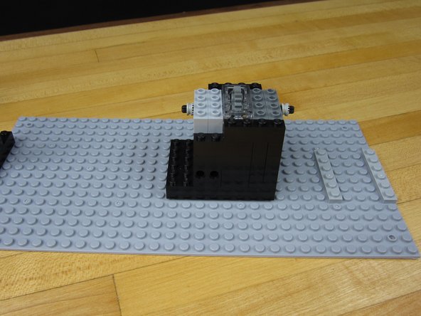We added some  1x4 Technic bricks for the end of our size 12 Axel from the X-Wing to go into. Attach those to the Axel.