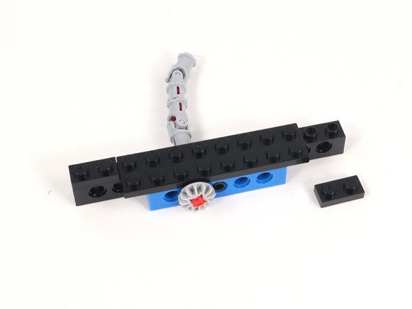 Add 1x2 plates to each end of the 1x12 brick with holes.