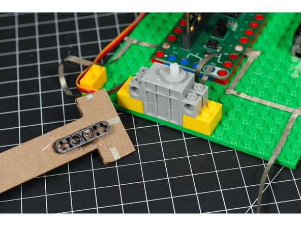 Before you attach the arm you should test your code to make sure the distance sensor works and that the servo moves properly.