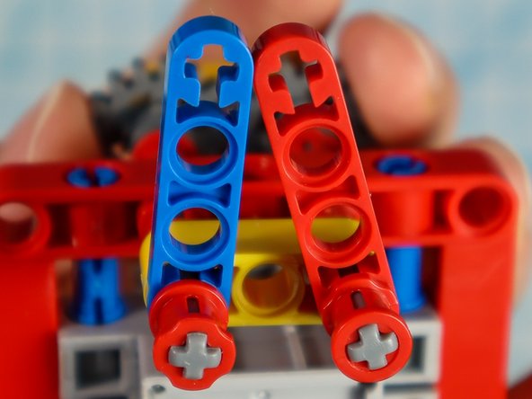 Align the two half beams so that they meet at the center. You may need to adjust the large gear to do so.