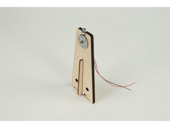 With the motor in place you can now slide the thinner piece of the windmill into place.