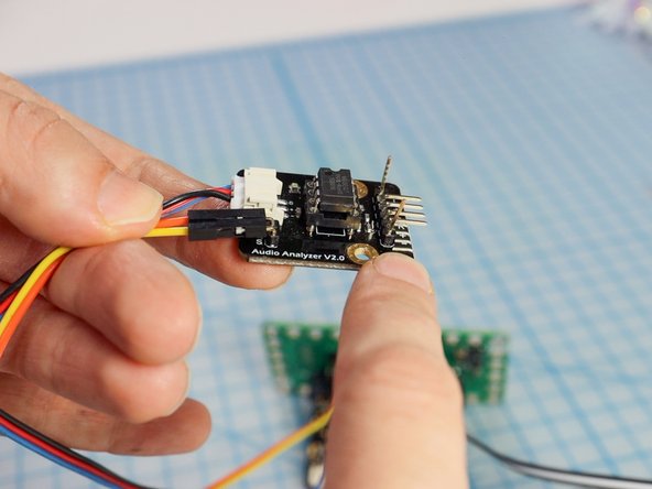 Use a piece of double-sided mounting tape to adhere the Audio Amplifier board to the bottom of the foam circles.