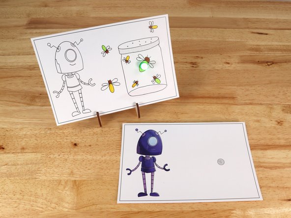 Poke holes through the front of the card for the LED legs, then push the legs through the front.