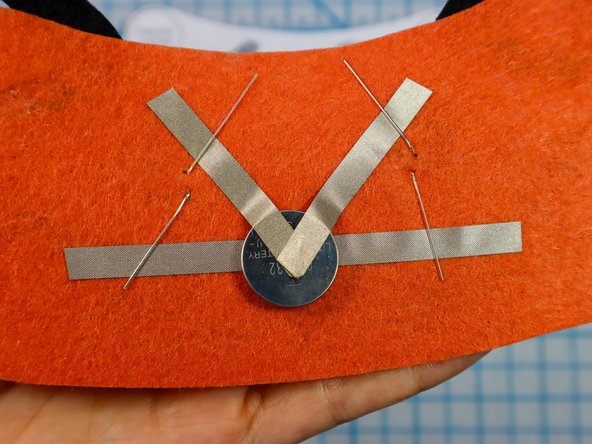 Place a piece of Maker Tape on top of each leg to make a secure connection.