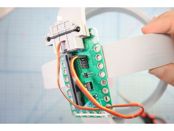 Connect the Servo to Pin 13 using the pins on the back of the Bit Board. The ground wire is the brown one.