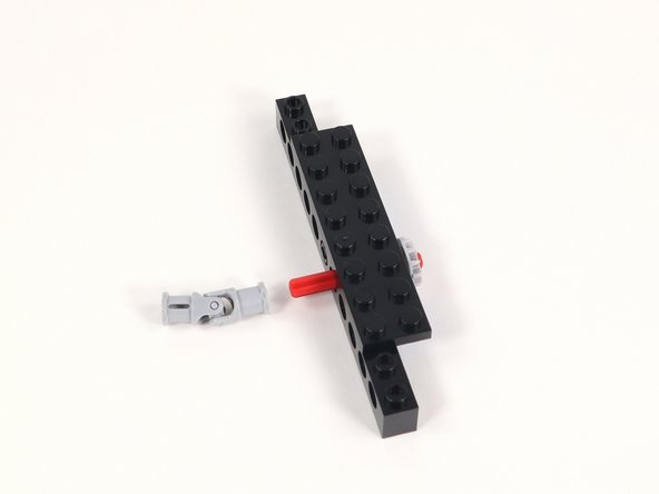 Connect one end of a universal joint onto the end of the axle opposite the gear.