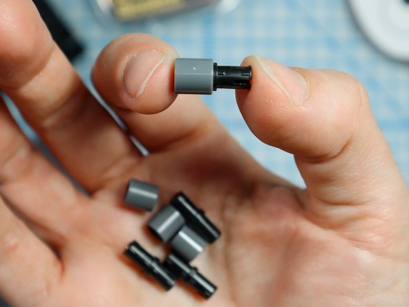 Connect each LEGO pin to a LEGO round beam as shown.