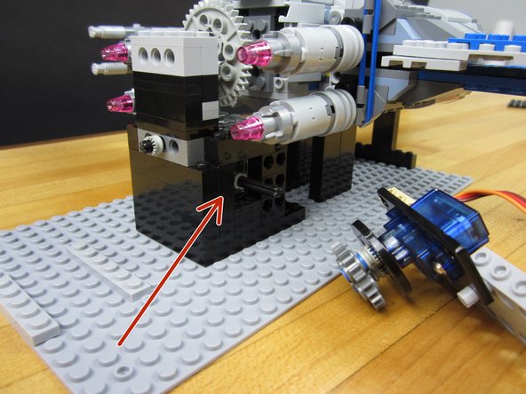 Pull the axel off the servo and push it into the worm gear in the gearbox.