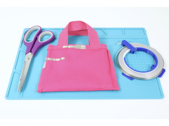 Follow the diagrams on the featured document or the photos at left to create Maker Tape paths where shown. Take note that there is an LED Side and a Battery Side of the bag.