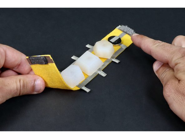 Use your scissors to trim the parts of the LED legs that hang off the edge of the bracelet.