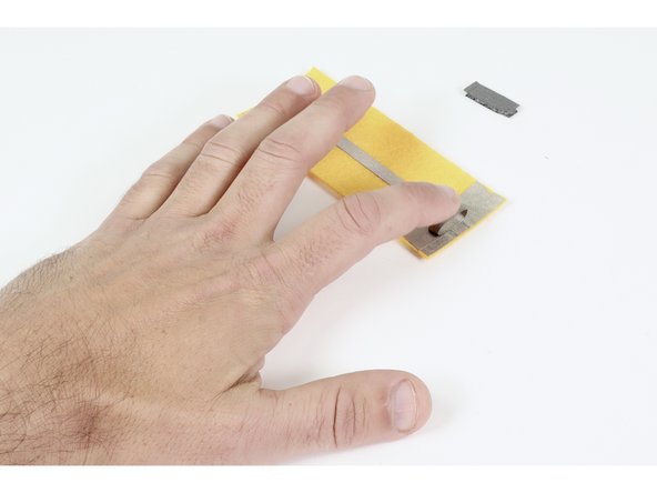 Press that tape loop into contact with one of the 2 widened ends of whichever circuit you are working on.