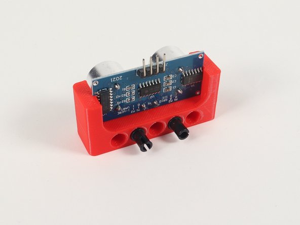 To mount it to the front of the Rover we'll use two pins placed into holes on the back.