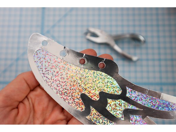 Use a hole punch to punch them out.