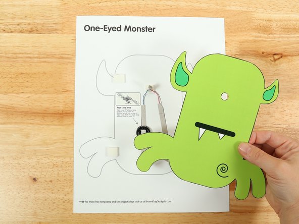 Place the cut out monster template over the top of the motor so the motor goes through the small hole you cut earlier.
