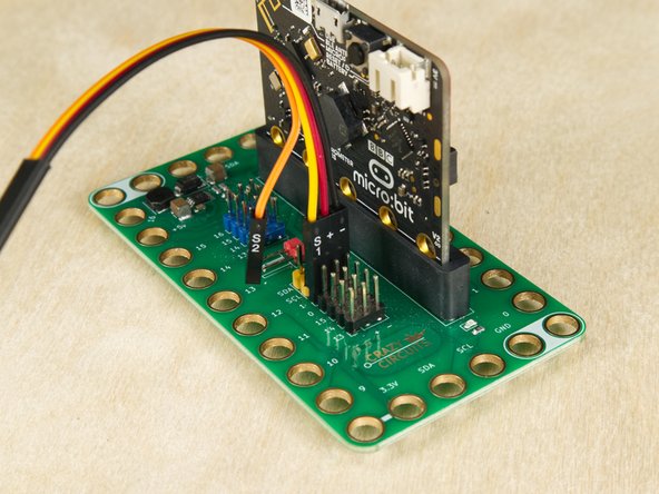 We'll add the 7 Segment Display by using a Crazy Circuits Ribbon Cable. Since each wire is labeled (and color coded) it's easy to make the connections.