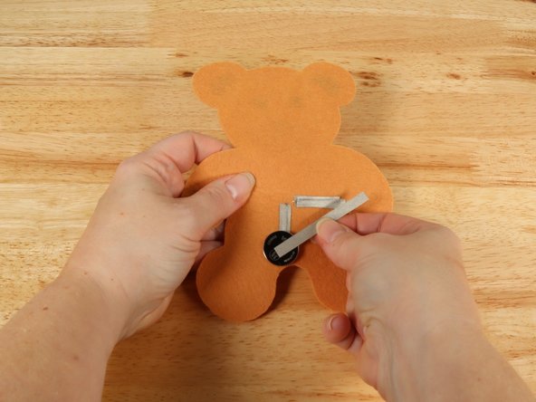 Add Maker Tape to connect the top (Positive) side of the battery to the Positive LED leg path.