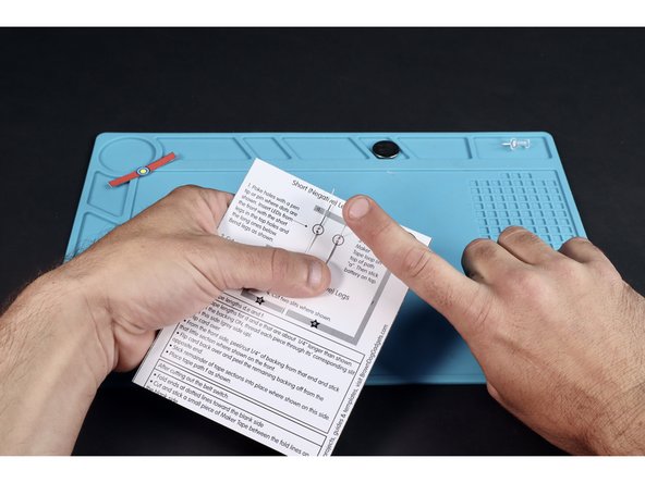 Bend the legs of the two LEDs in opposite directions as shown.