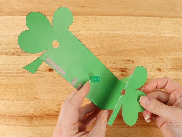 The two innermost dotted lines should be folded with a valley fold. When done correctly, the two halves of the shamrock will line up with each other around the LED.