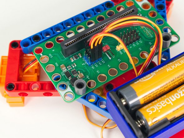 Finally, plug the center rear servo into the row for Pin 15, matching the orientation of the servo connector for the other two servos.