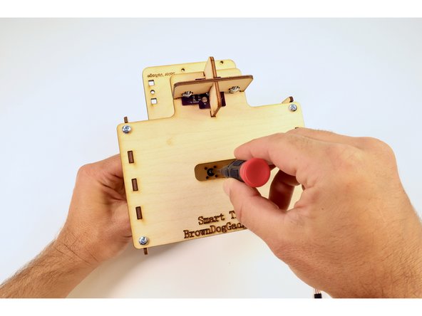 Use your hand to reposition the solar panel plate angle so that the hole in the center allows easy screwdriver access to the small screw. Then tighten to secure these two assemblies together.