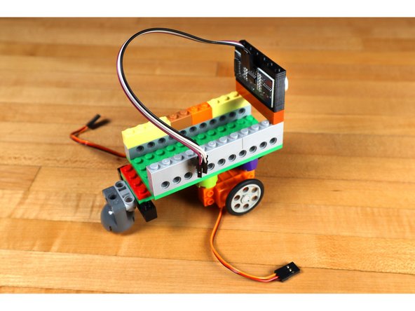 If you do not have access to a 3D printer, you can fashion a way of holding the sensor in place using some LEGO pieces, tape, rubber bands, zip ties, or some other method. The important thing is that it should point towards where the robot is going when it is moving forward.