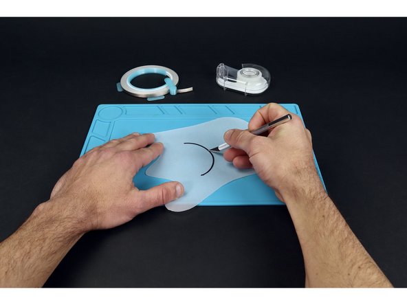 Use a marker to draw an expressive mouth on the vellum  and them a craft knife to cut it from end to end. This should allow you to pull the mouth away from the rest of the shape a bit as pictured in photo 3.