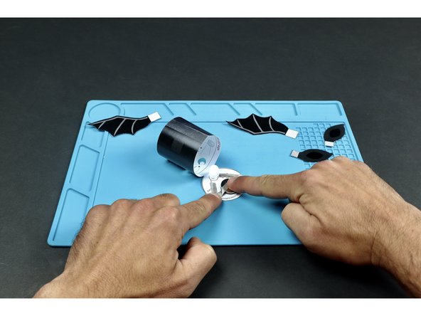 Add the final piece of Maker Tape and fold the lid down to seal the deal! Note: Connecting this final piece of Maker Tape to the top of the battery turns the light on. Peeling it back will turn it off.